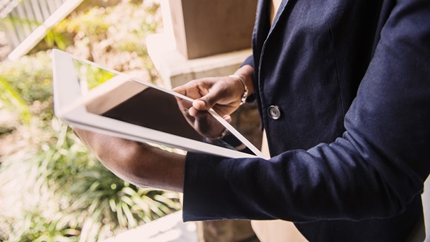 A woman looking at a tablet