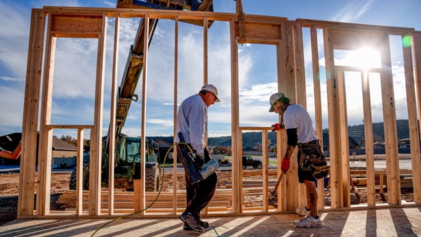 Construction workers in California building a home