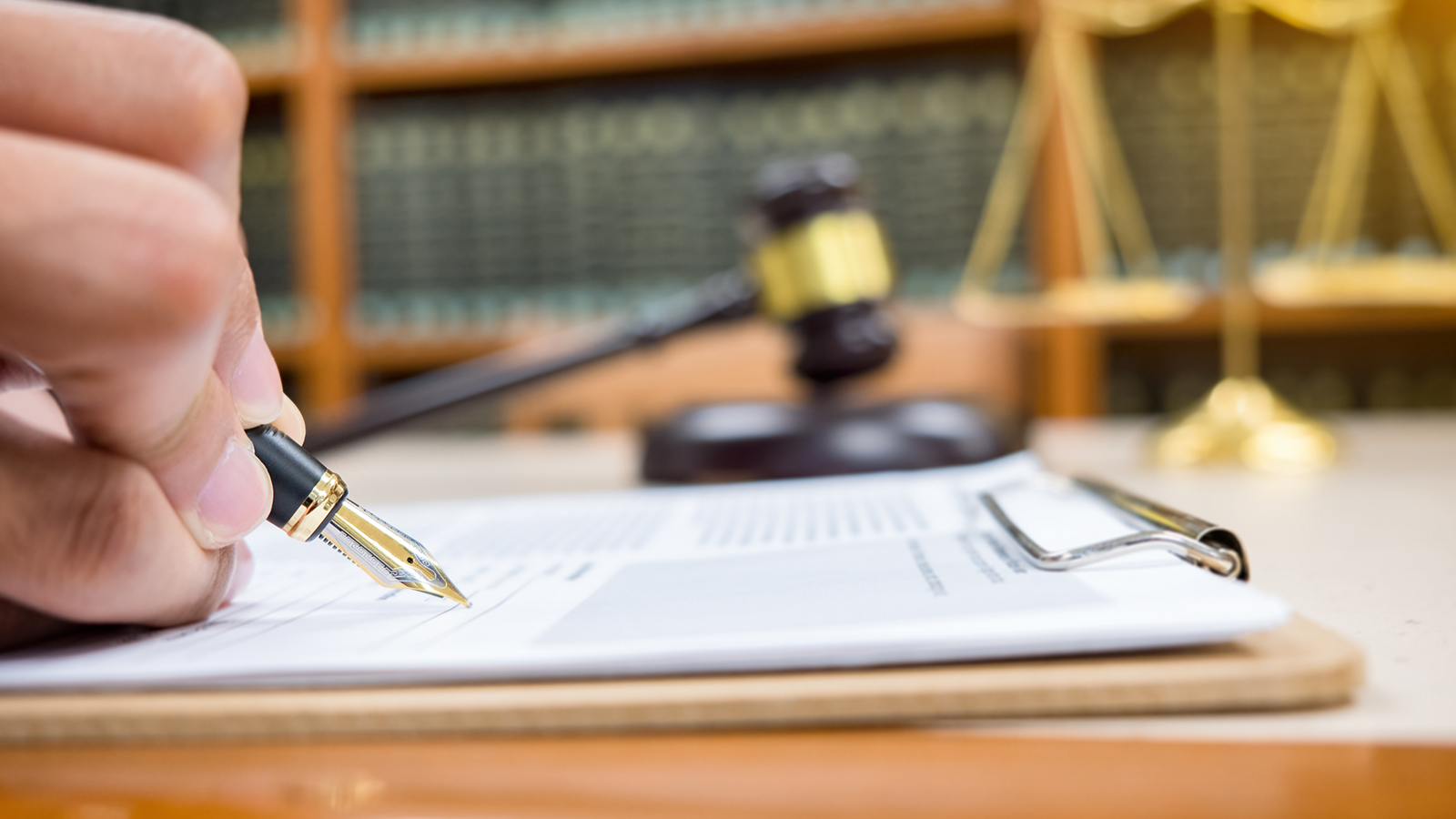 gavel and pen and paper