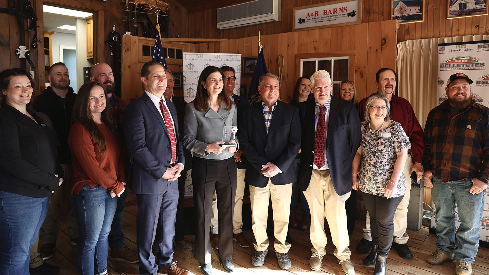 group of individuals with govenor with award