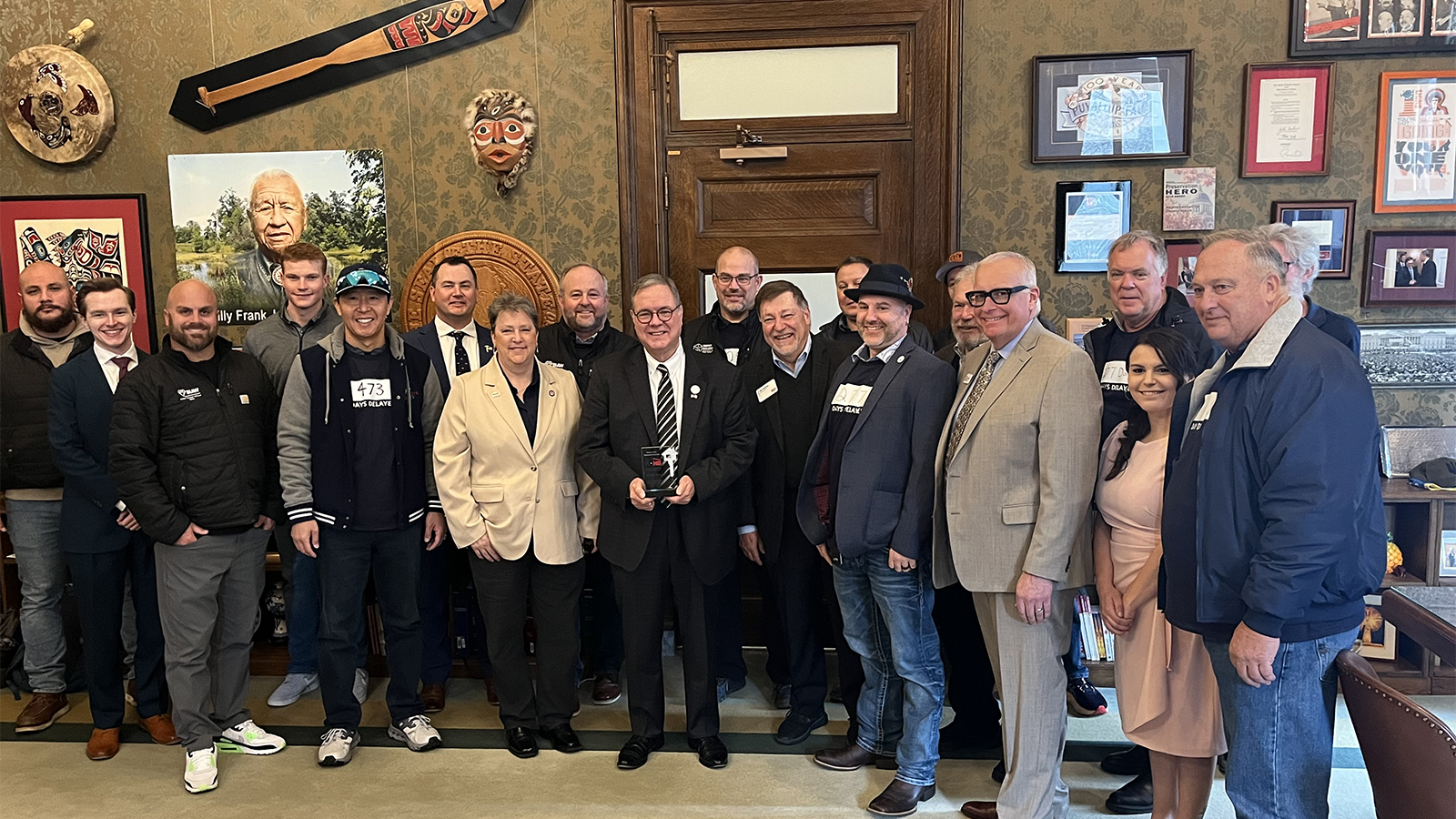defender of housing honoree with group of nahb members and staff