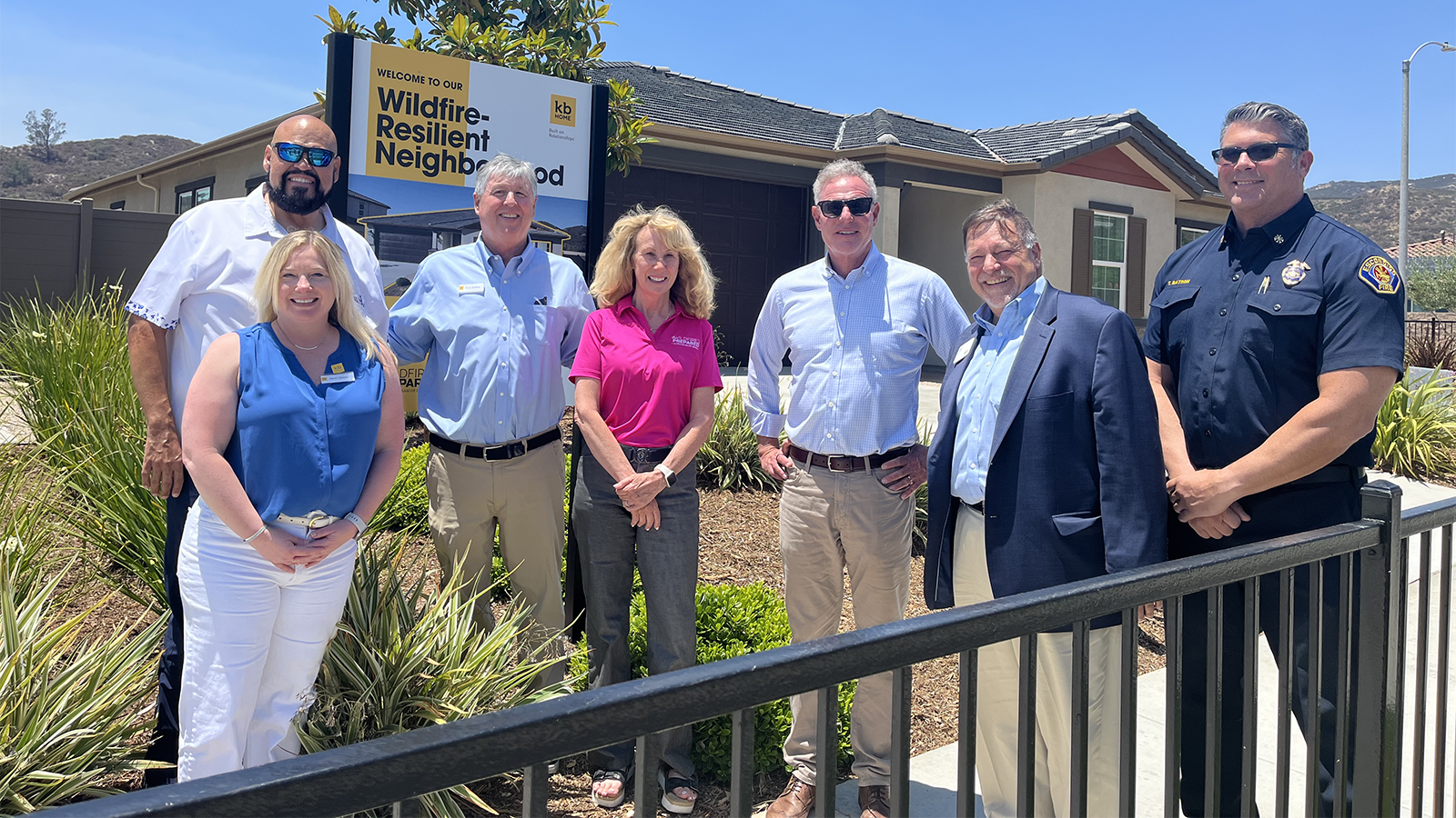 group of individuals standing in front of home