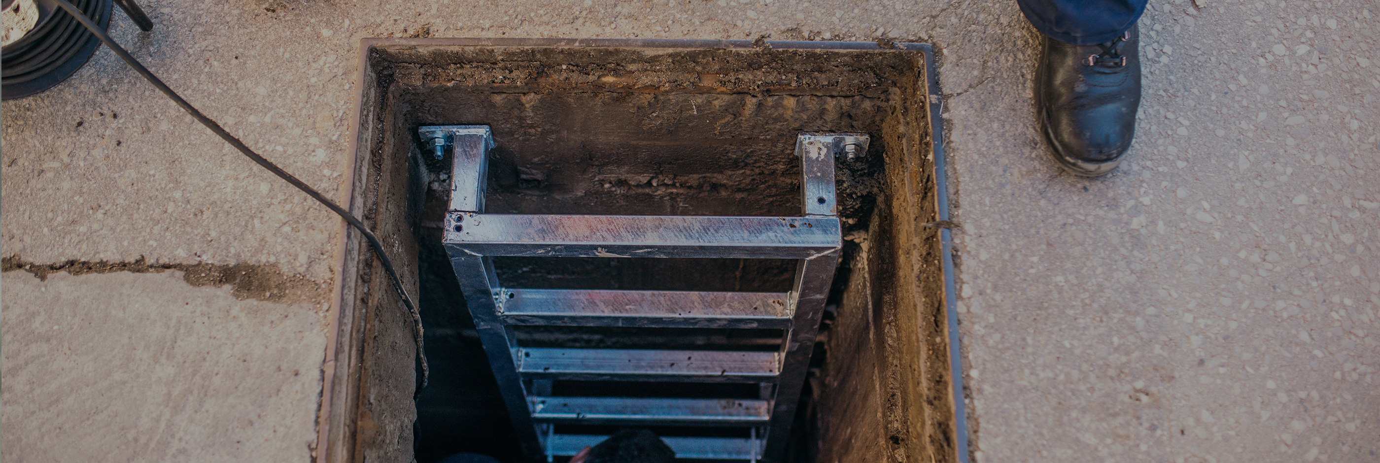 A narrow entrance to an underground work area
