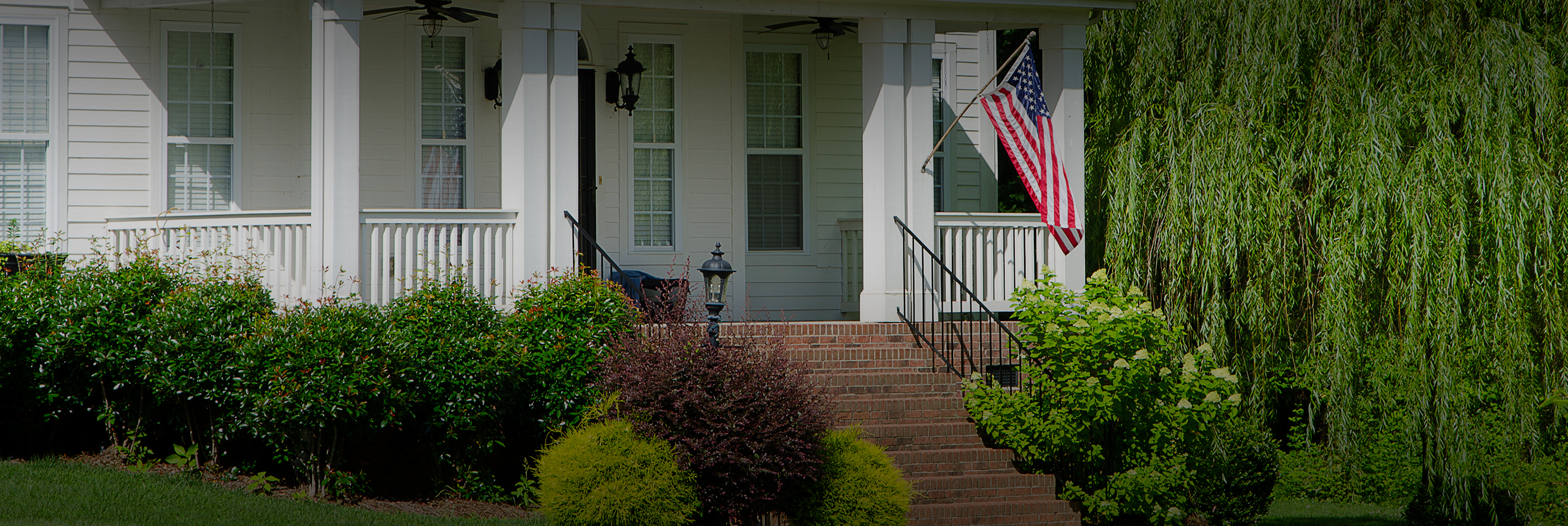 White house with american flag on porch