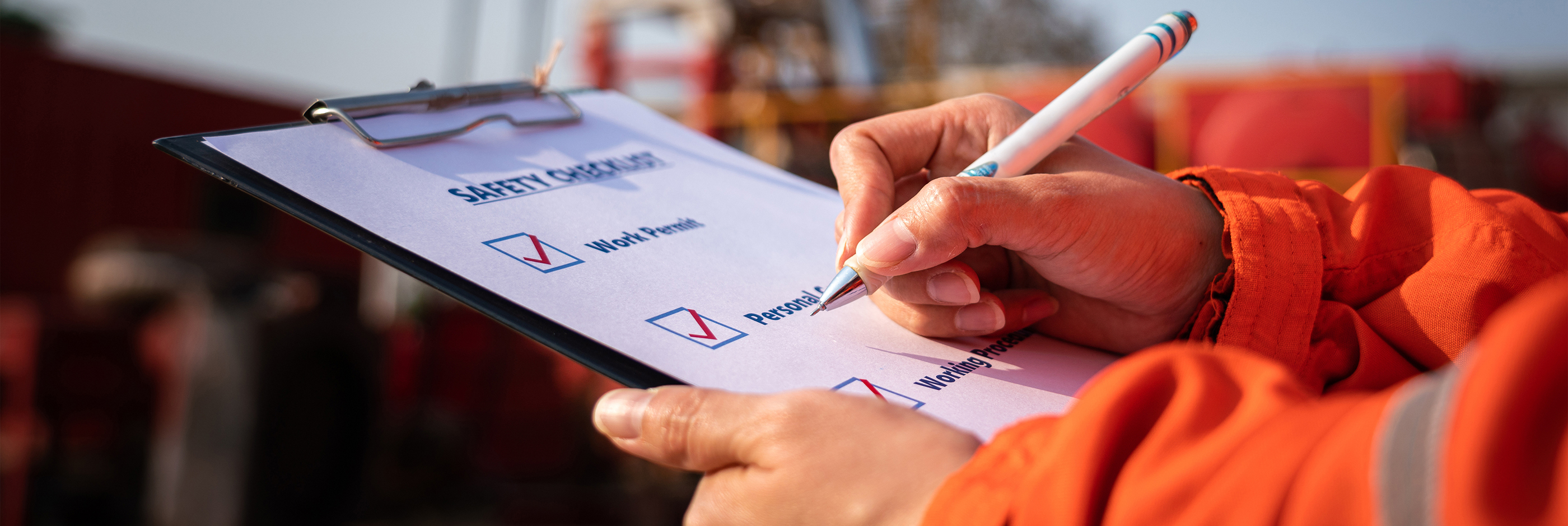 Someone checking off a checklist