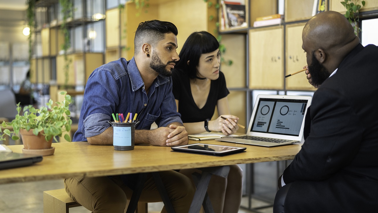 Couple consulting a professional about solar system