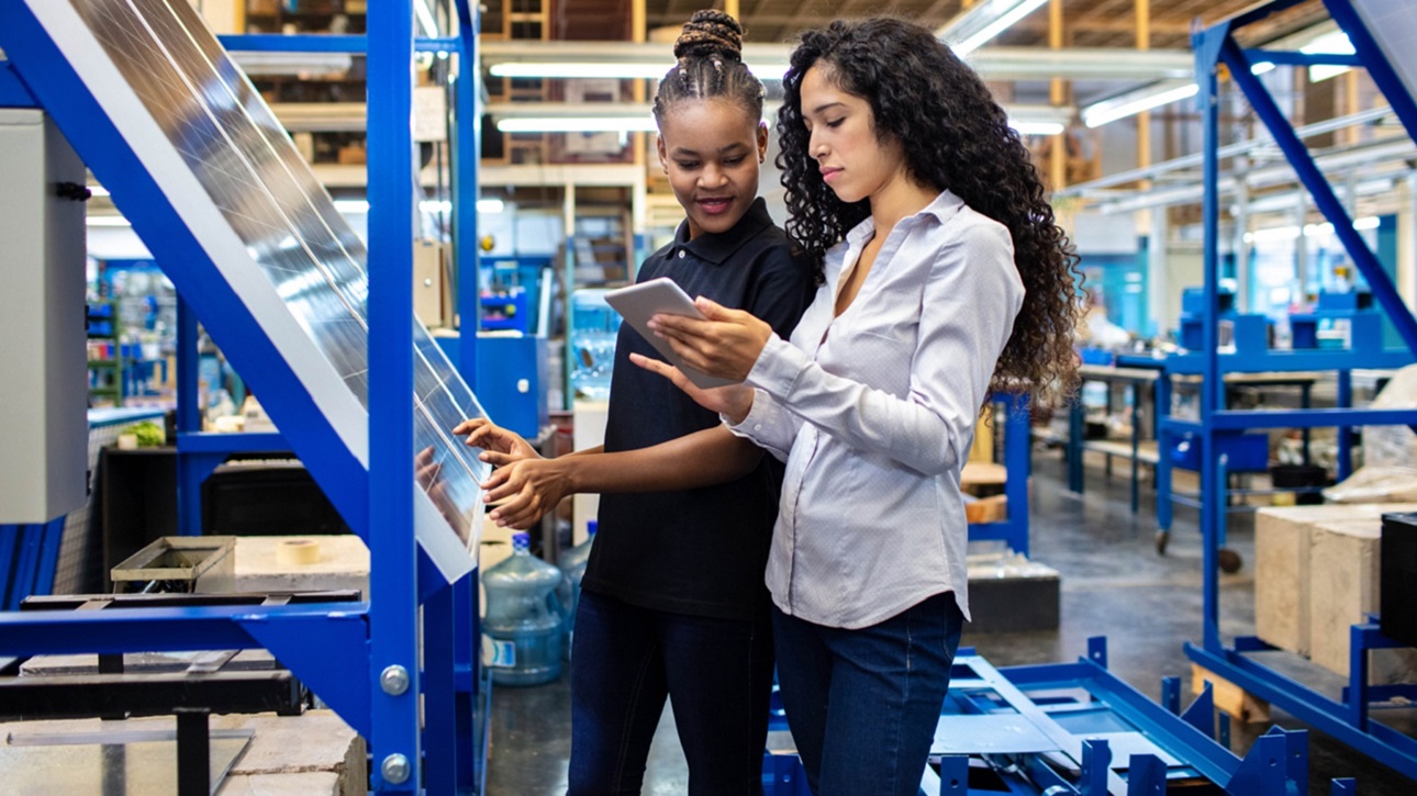 Two women at the solar equipment manufacturing company