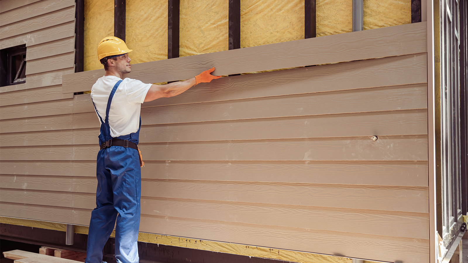 Siding being installed on a home