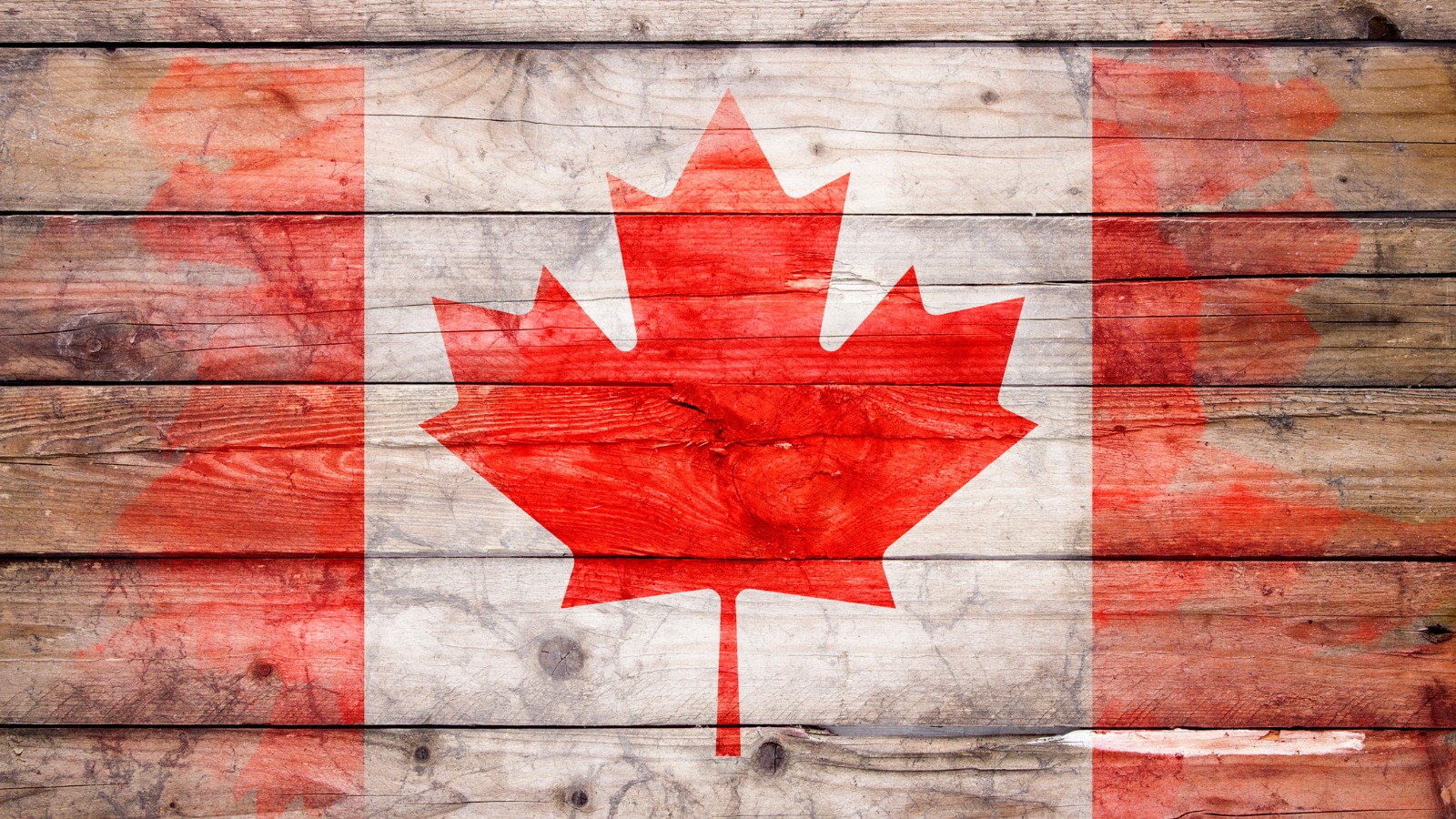 Canadian flag on wooden background