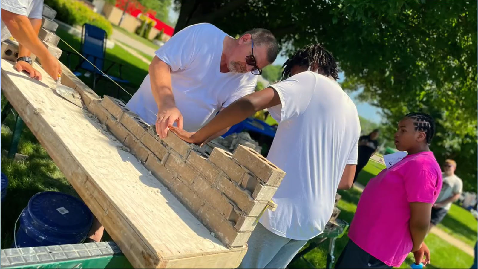 Boys and Girls club practising bricklaying