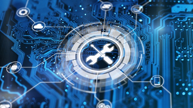 Wrench and screwdriver icon in the middle of a computer chip