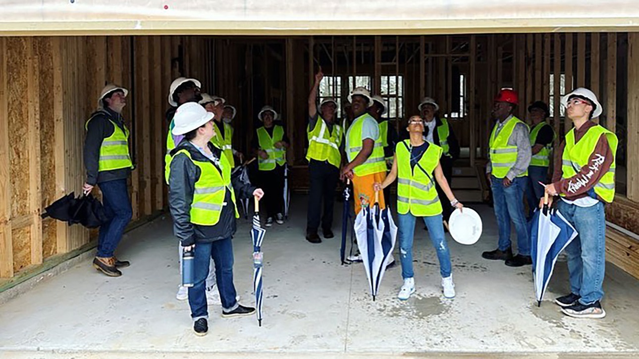 students visiting home under construction