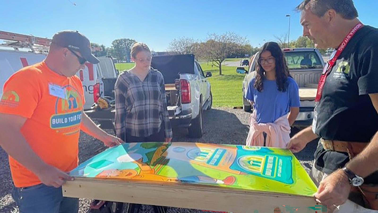 BAEC members guide students through a build activity.