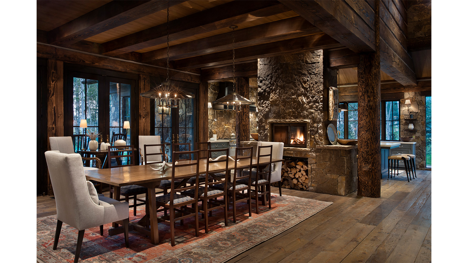 The dining room and fireplace of the winner of the Best in American Living Award for Best Log Home Design