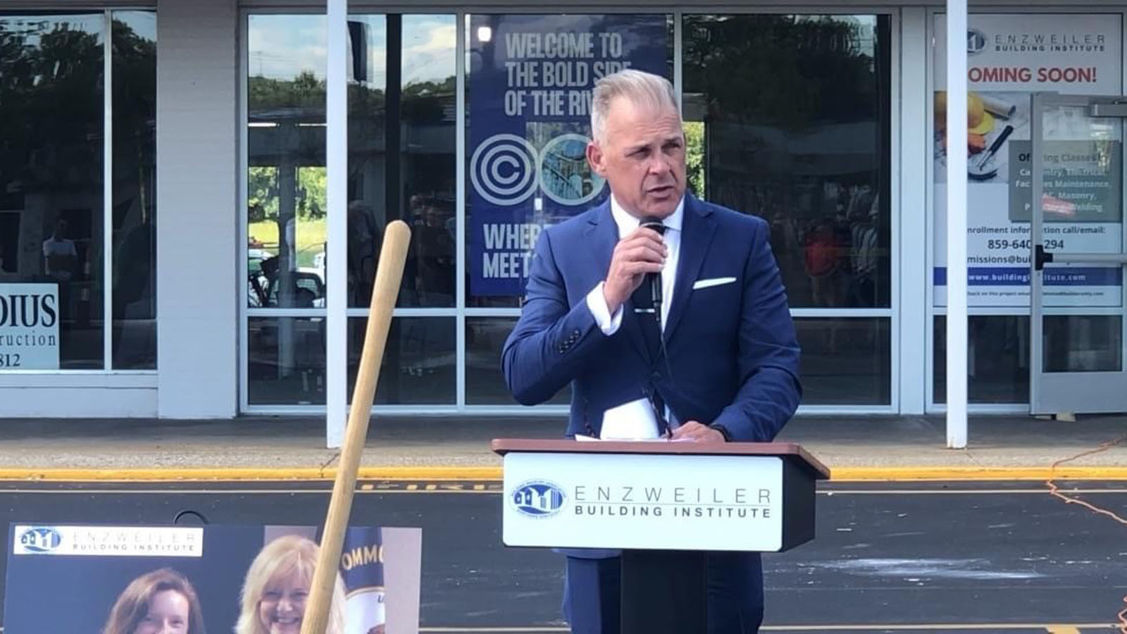 Brian Miller talking into a microphone at a podium 