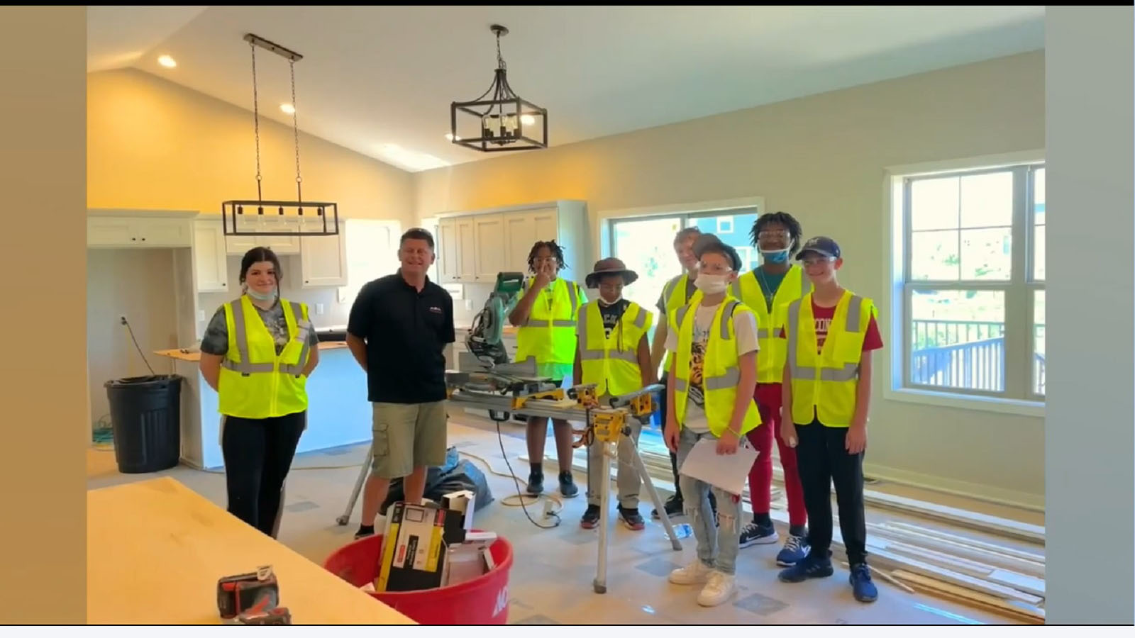 students take tour of unfinished home