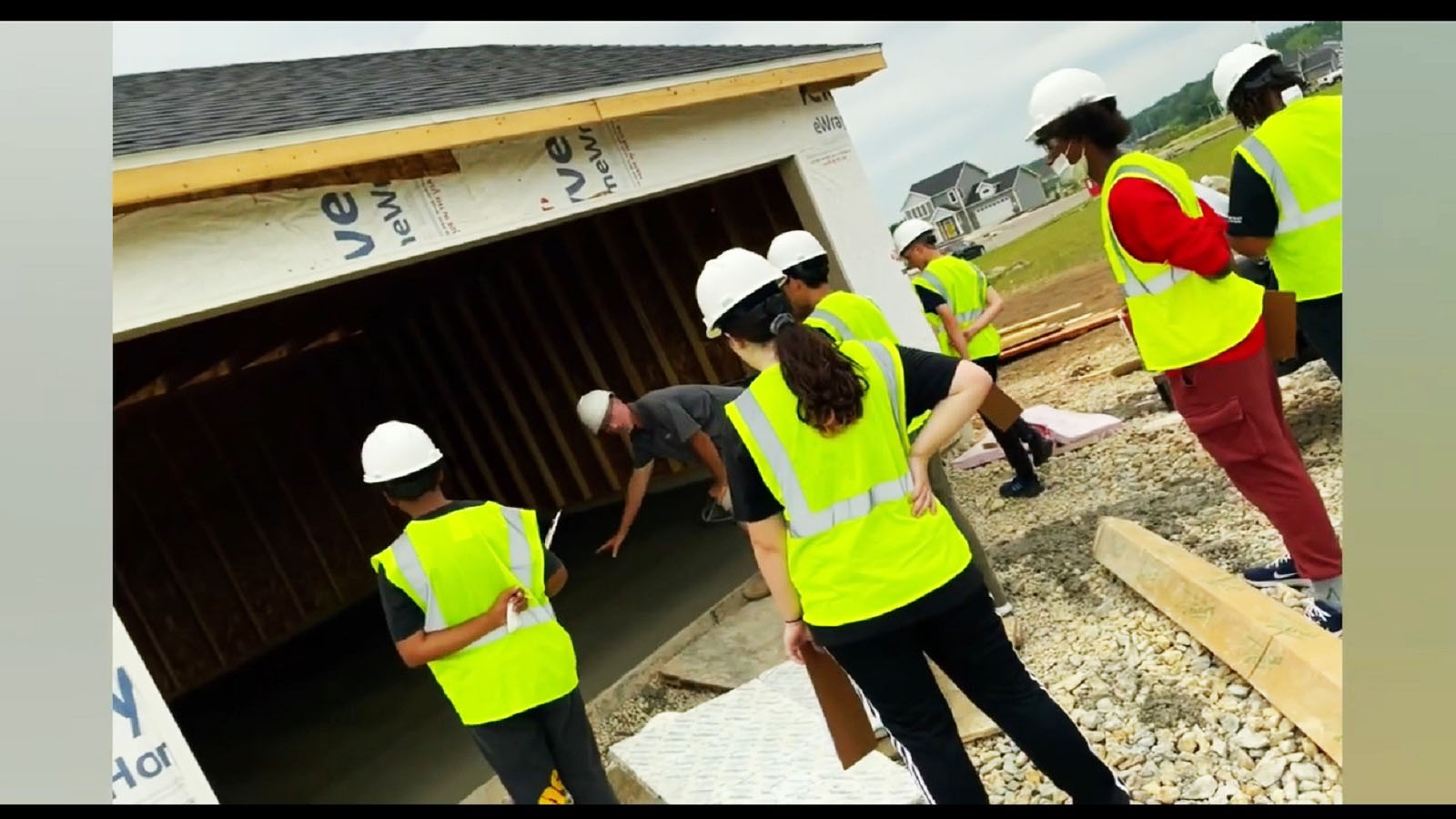 students tour a job site