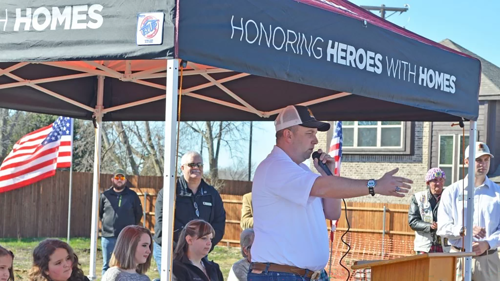 A veteran speaks at an Operation Finally Home groundbreaking ceremony.