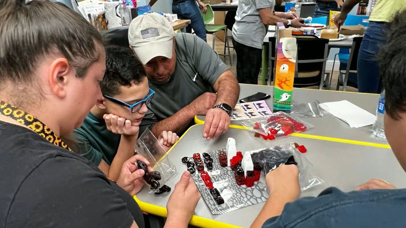 students build haunted house with candy