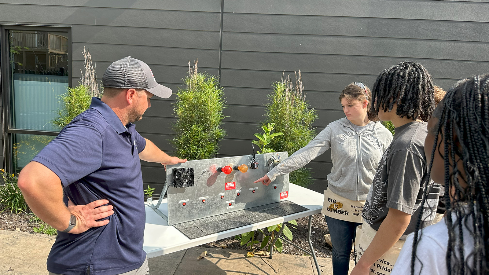 A member of the HBA of St. Joseph Valley guides local teens through basic construction concepts.