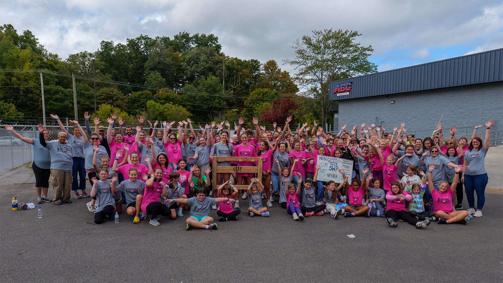 Students and volunteers display a completed project.