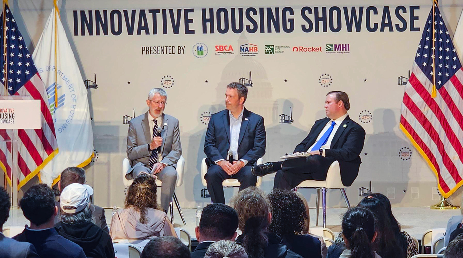 Bill Owens speaks during a panel discussion at the Innovative Housing Showcase