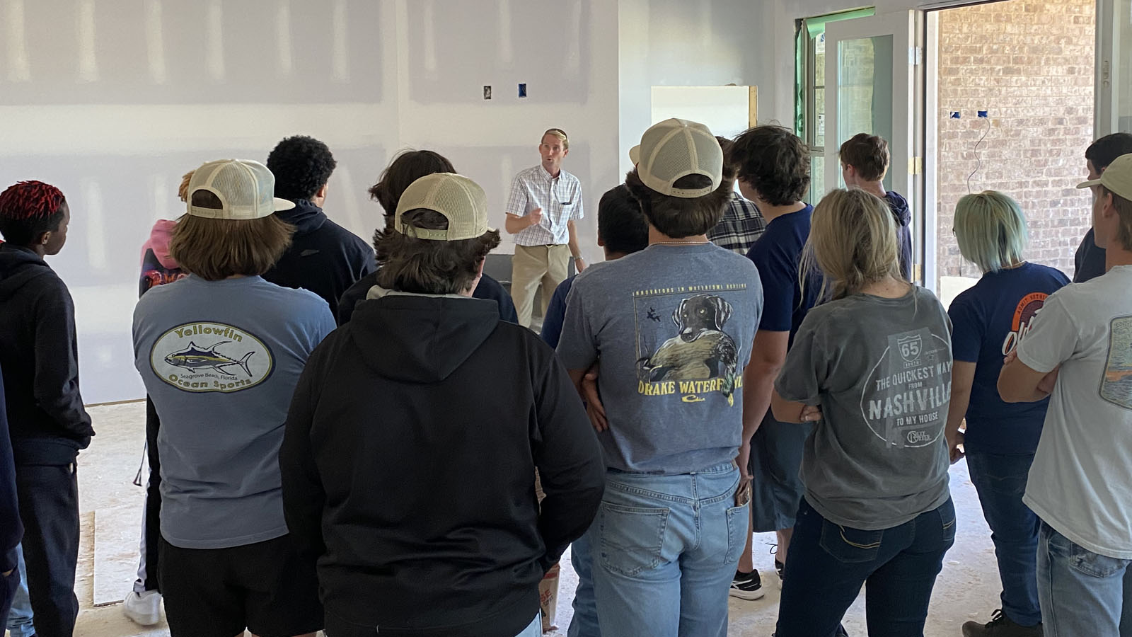 subcontractor talks to students