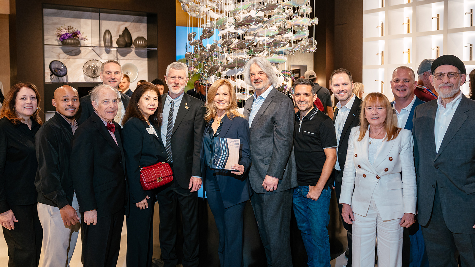 Presentation of NAHB Global Humanitarian Award: (l to r) Front, left: Beth Bouck, Sr. Director Kohler Marketing; Alfred Richardson, GM Kohler Cross Category Marketing; S. Robert August, NAHB Global Opportunities Board member; Shawn Oldenhoff, Sr. VP Kohler Marketing; Giuliana Nava-Cord, NAHB Sr. Director of International Operations; Bill Owens, NAHB First Vice Chairman; Laura Kohler, Sustainable Living Officer for Kohler Co.; Steve Kleber, 2024 NAHB Global Opportunities Board Chair; Italo Martin, 2025 NAHB Global Opportunities Board Chair; Norbert Schmidt, President of Kohler KB North America; Jillian Pritchard Cooke, NAHB Global Opportunities Board member; Jake Lawson, Sr. VP Kohler Sales; Jeff Wilson, NAHB Global Opportunities Board member. Copyright Nick Hagen Photography.