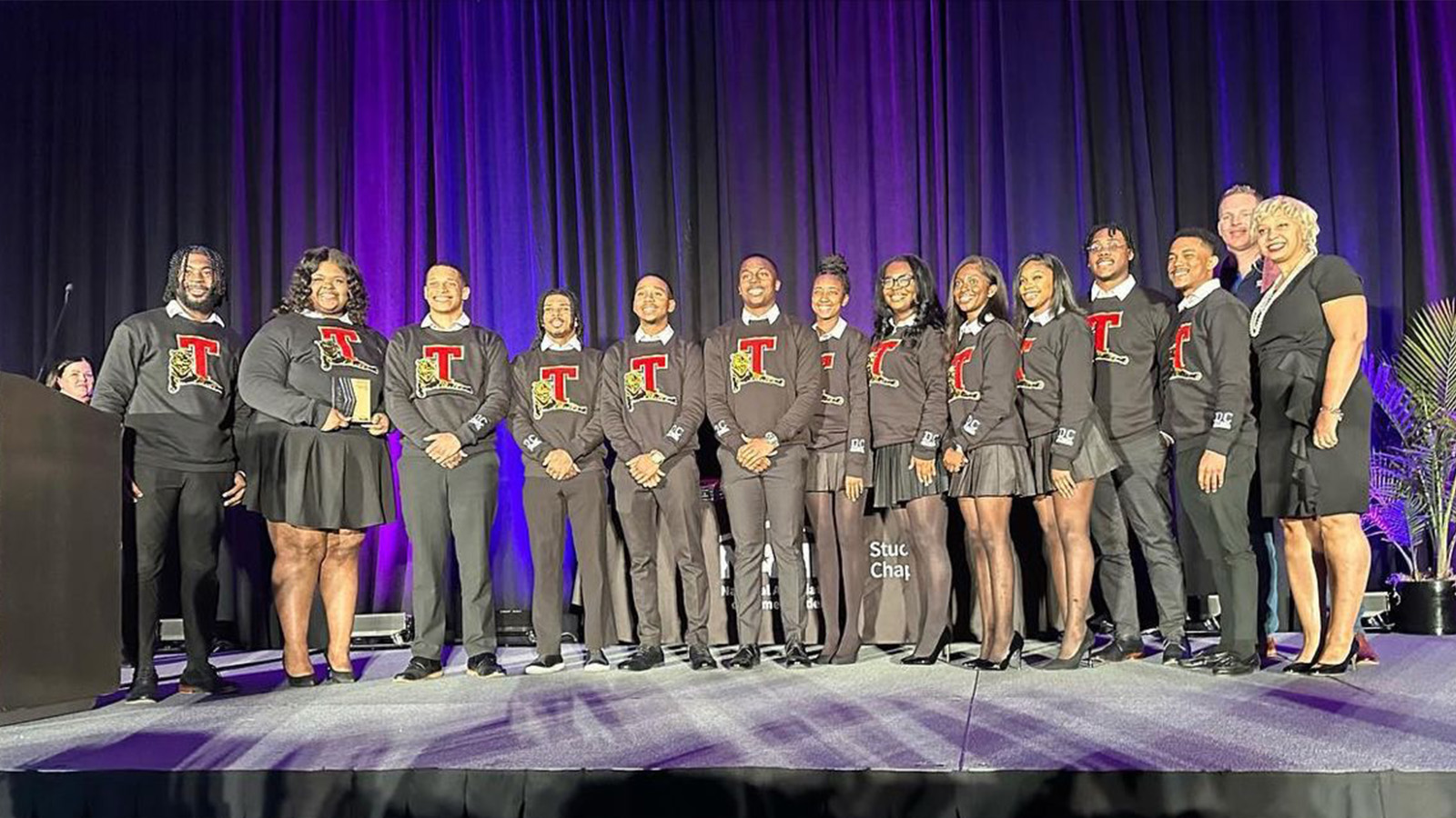 Lawrence Thompson with Tuskegee classmates celebrate IBS win