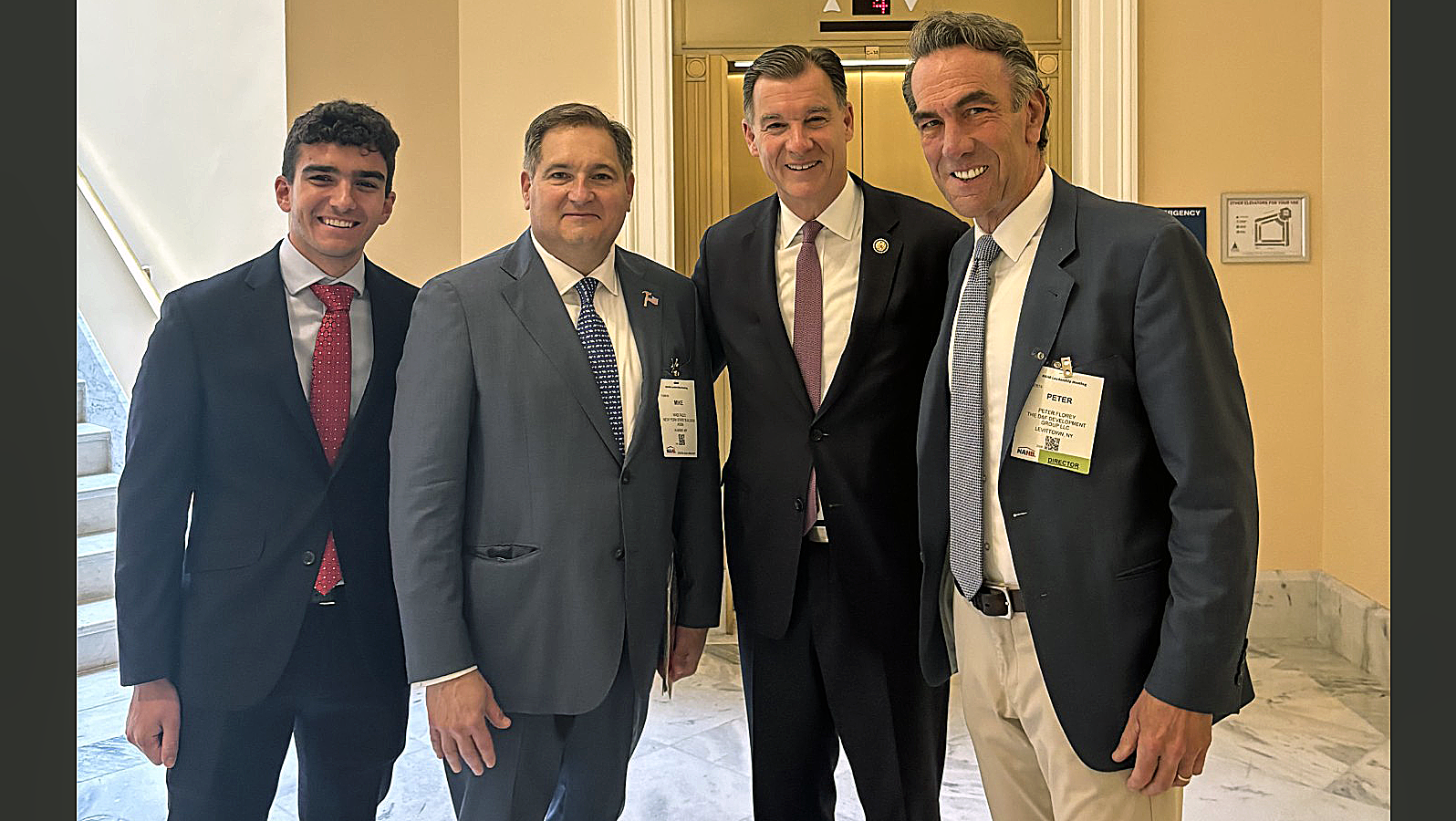 Rep. Tom Suozzi (D-N.Y.) (second from right)