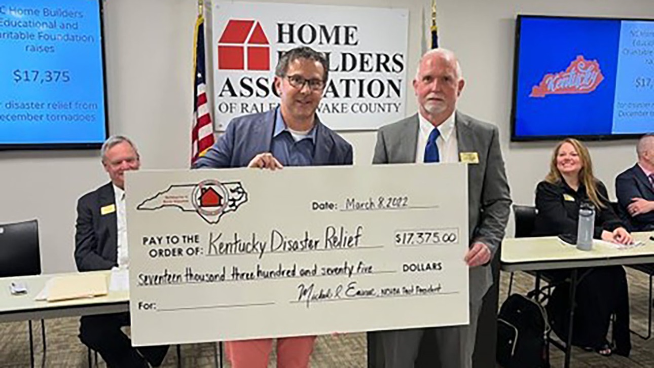 north carolina home builders with large check for disaster relief