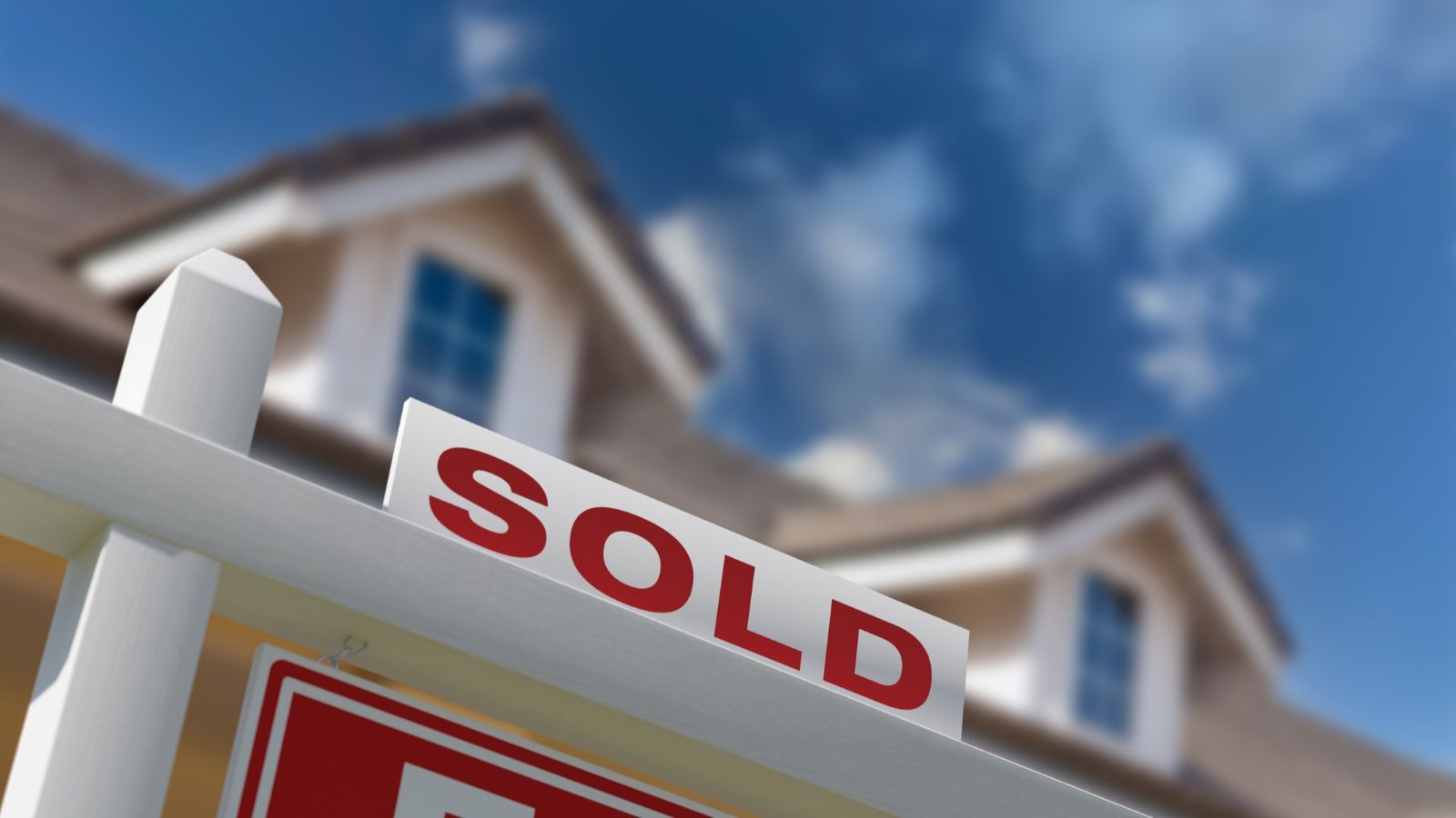 Sold sign in front of a home