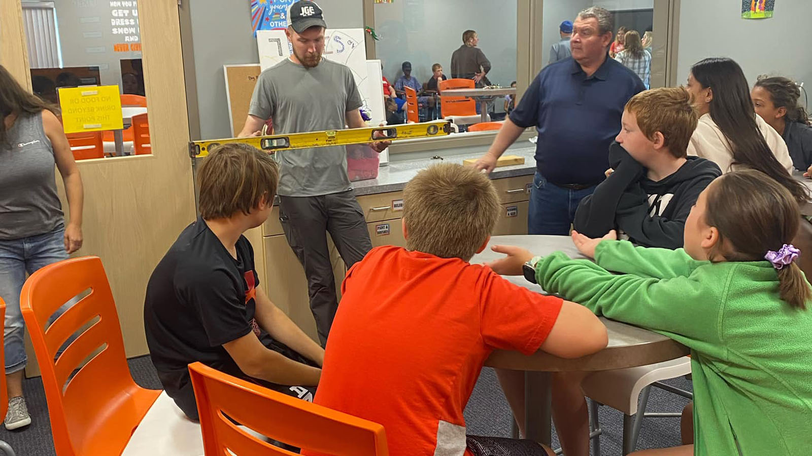 teens learn about how to use a level