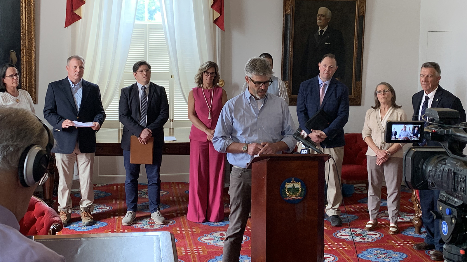 individual speaking at podium