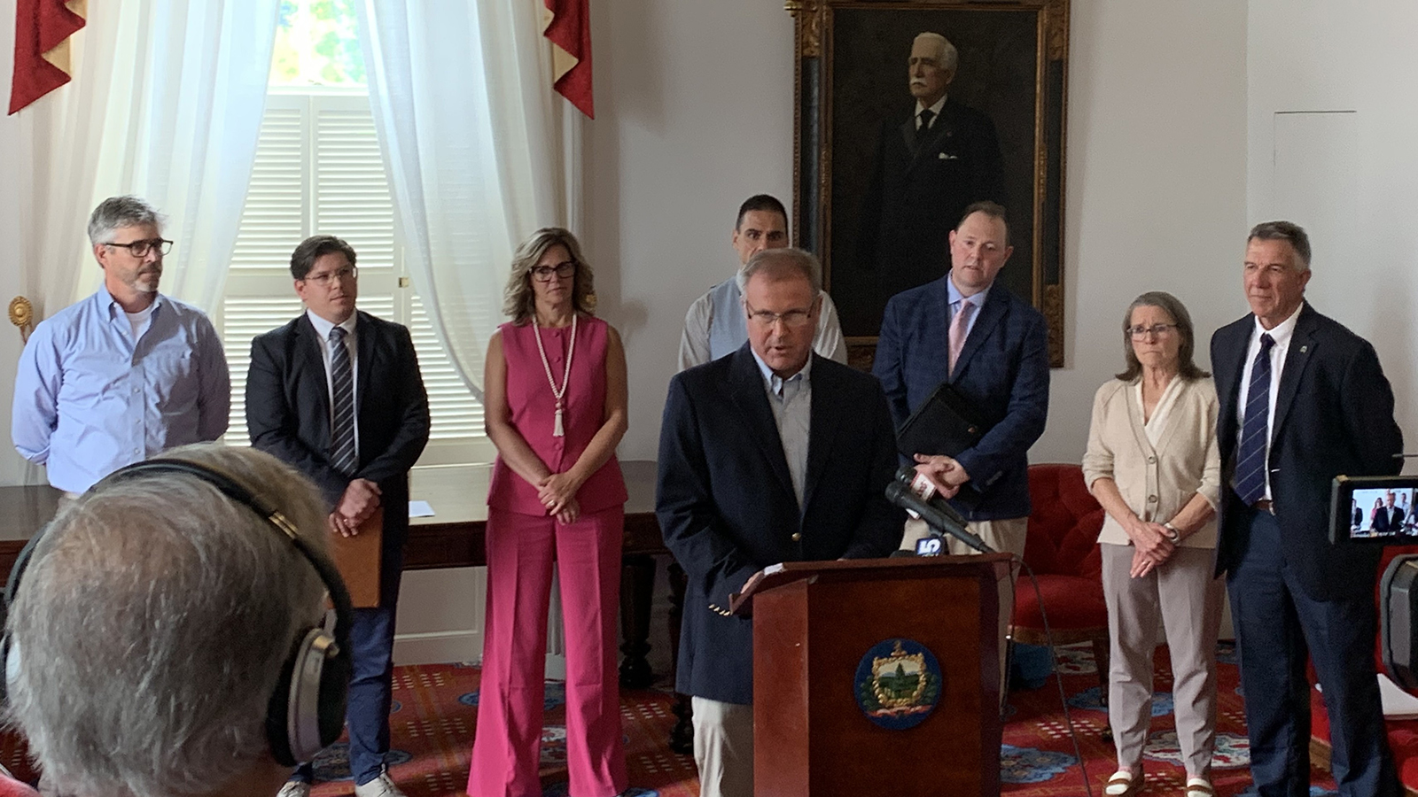 individual taking questions at podium