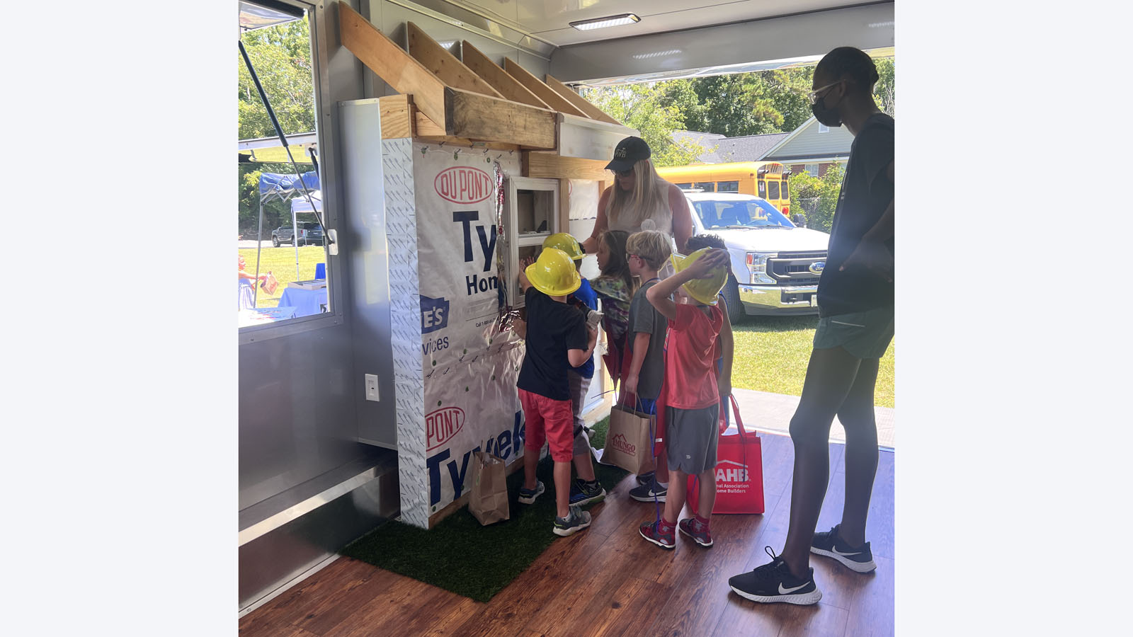 children looking at a construction demo