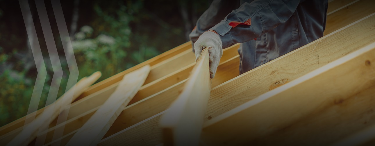Builder reparing the roof after a disaster