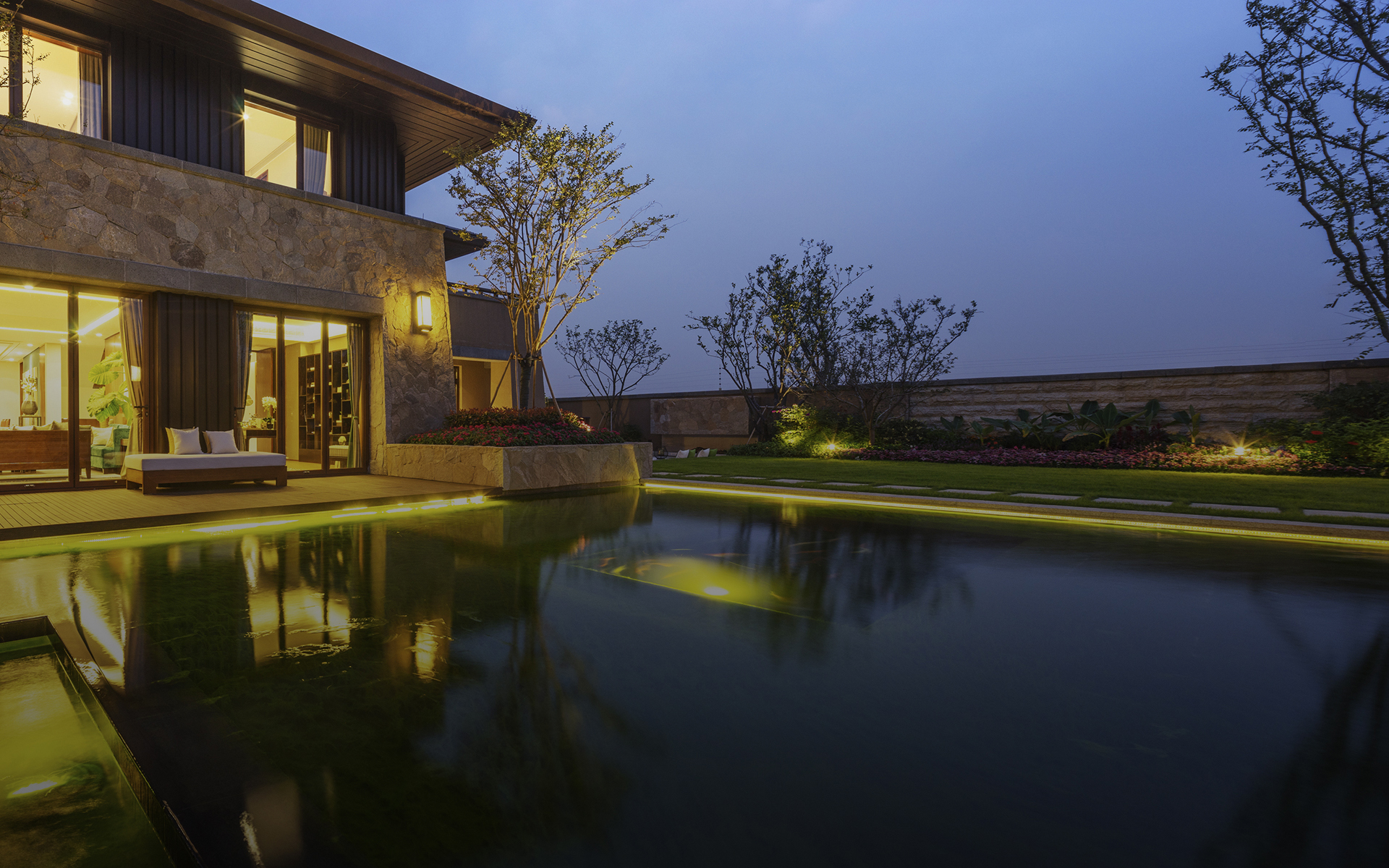 Single family two storey home with a pool in the front yard