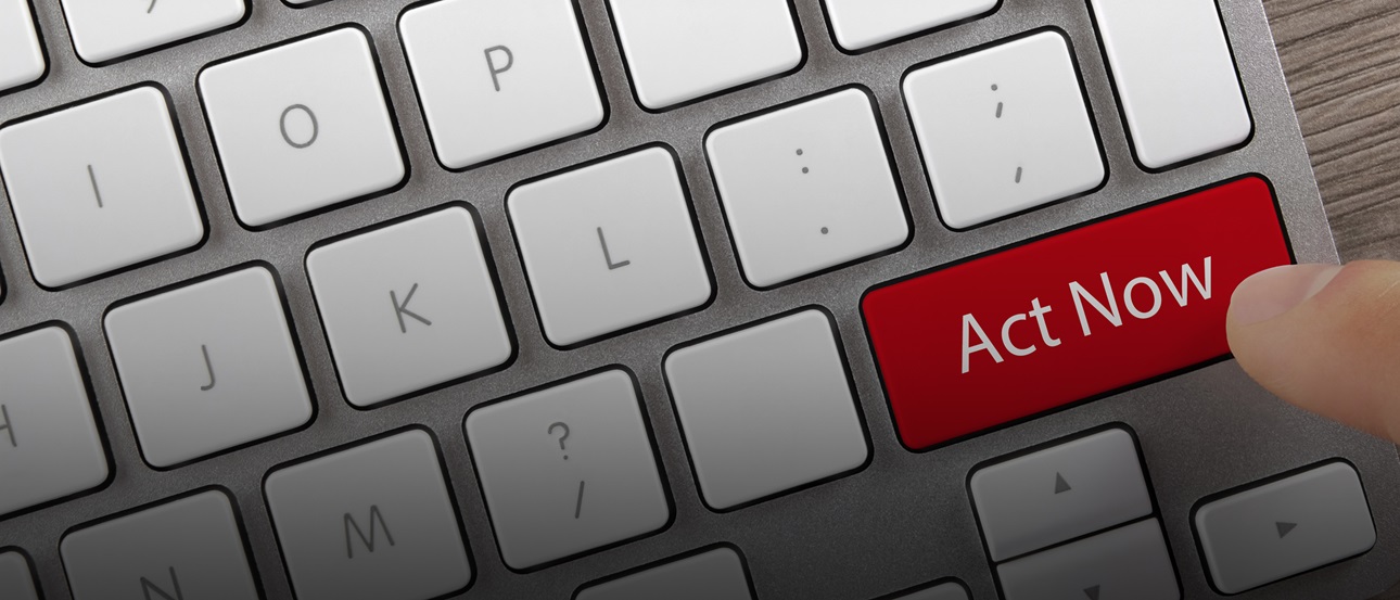 A computer keyboard with a red "Act Now" button