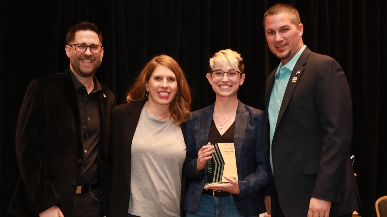 Jordyn Croom (second from right) accepts her award at IBS 2020
