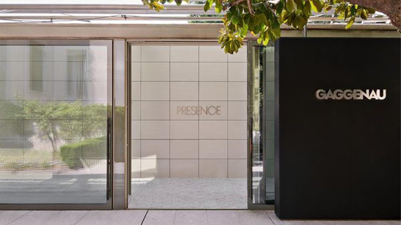 Large glass lift-and-slide doors installed with a flush threshold in a modern outdoor space.