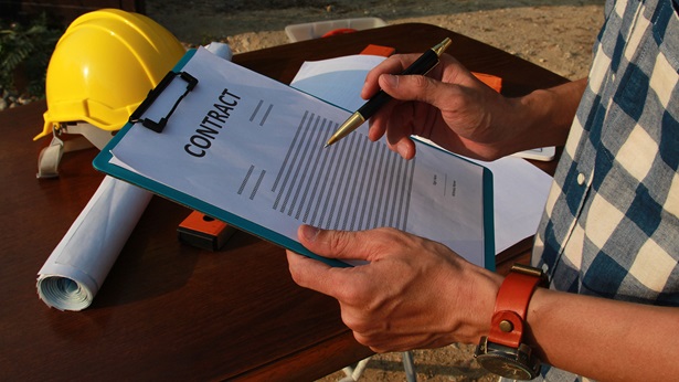 A contractor reviewing a contract document