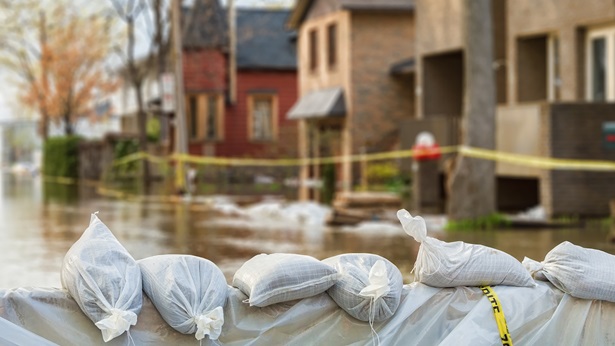 A flooded streed with the sandbags