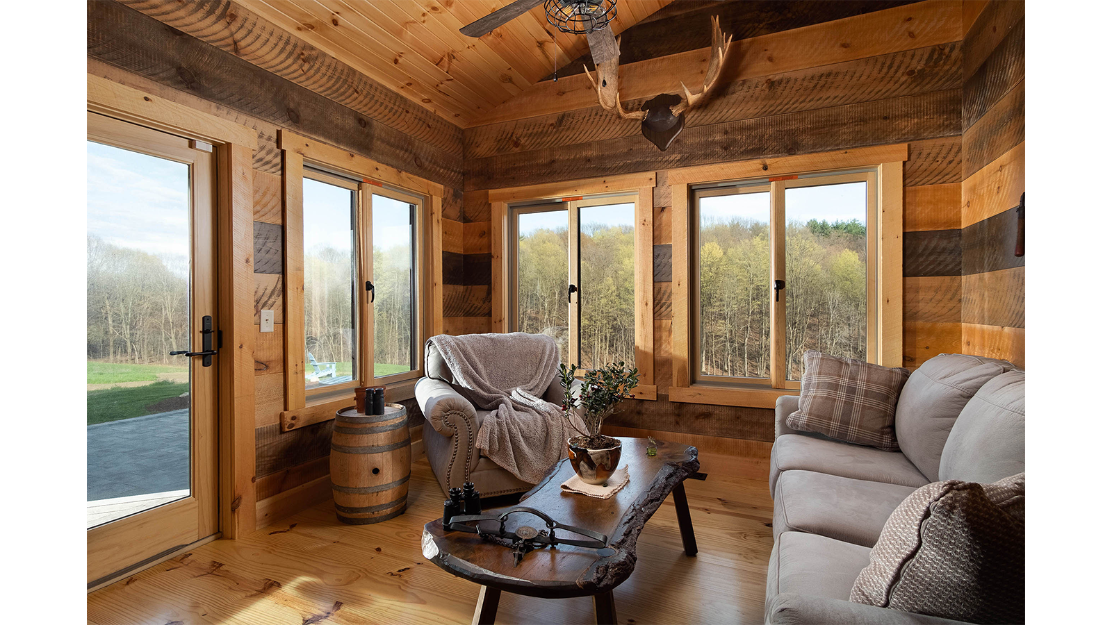 The rear sunroom of Timberhaven's Saratoga timber home