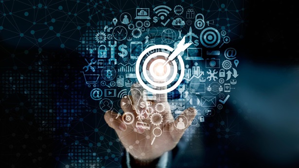 A man's finger touching the center of a digital bullseye board