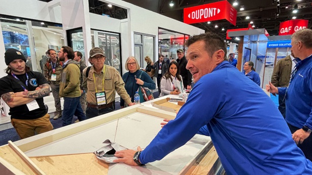 A man demonstrating a skill at the 2023 IBS show floor exhibit