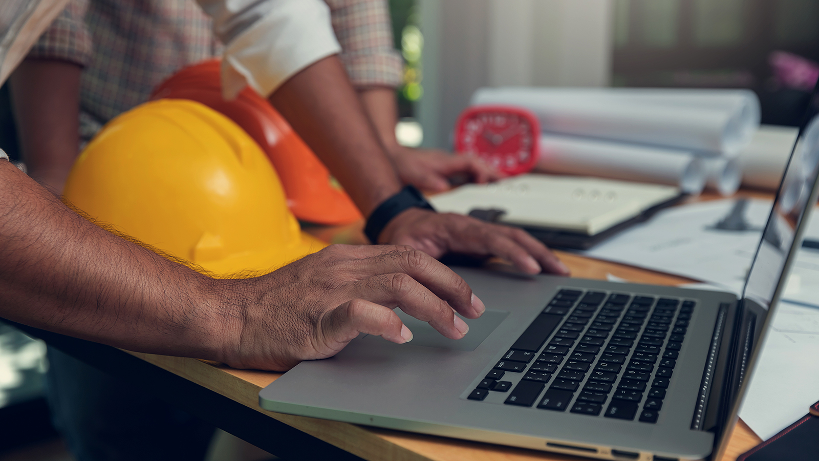 Construction man working on laptop